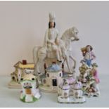 A Staffordshire flatback figurine with Coalport cottages, bisque figure and two German figures.