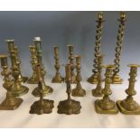 Selection of various brass pairs of candlestick holders. IMPORTANT: Online viewing and bidding only.