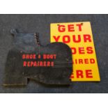 A cobblers set of irons and two shoe repair signs.. IMPORTANT: Online viewing and bidding only.