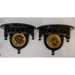 A pair of late Victorian decorative wall bracket shelves with gilded central hand painted panels,