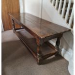An 17th century oak refectory table with three oak planks to top,turned column legs and four