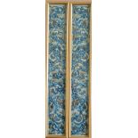 A pair of framed silk embroidered blue kimono sleeve panels, butterfly and leaf design, 59cm x