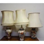 Three Chinese style lamps, in various floral and bird designs, approx. heights 40cm. IMPORTANT: