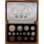 A boxed 1937 coin set to include maundy coins, along with two five shilling coins and three other