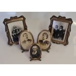 Two pairs of hallmarked silver fronted photograph frames, along with a smaller example of the one