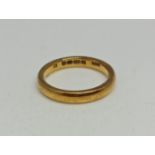 A hallmarked 22ct yellow gold plain wedding band, ring size M, weight approx. 5g. IMPORTANT: