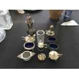 A collection of hallmarked silverware, to include a sugar shaker, a pepperette, a pair of salts, a