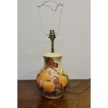 A Moorcroft Berry and Bird pattern on beige background lamp base, stamped to base, height of base