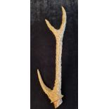 Intricately carved folk art deer antler depicting scenes from the Sanskrit ancient Indian epic