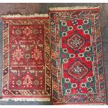 Two Afghan style red and turquoise patterned rugs, 155cm x 76cm and 134cm x 69cm. IMPORTANT: