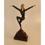 An Art Deco style figurine female dancing with arms lifted, height 33cm. IMPORTANT: Online viewing