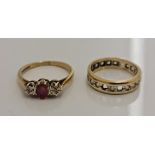 A hallmarked 9ct yellow gold three stone ruby and diamond ring, ring size N, approx. weight 2.1gms,