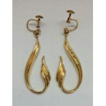 A pair of curved design drop earrings, findings stamped 9ct, weight approx. 4.3g. IMPORTANT: