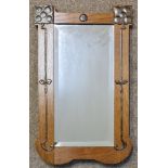 An Arts & Crafts oak framed wall mirror decorated with Art Nouveau copper floral detail, 64.5cm x