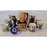 A collection of Winston Churchill memorabilia including character jug, figurines, mugs,