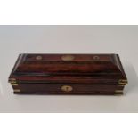 An early 19th century mahogany travel inkwell with brass corner mounts and detail to top, approx.