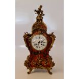 A Marque Deposee French, red Tortoiseshell Boulle clock with ormolu mounts, height 55cm.