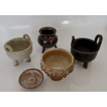 A selection of Lotus studio pottery three bowls on raised feet, bowl, and small dish. IMPORTANT: