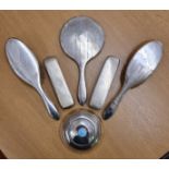 A hallmarked silver dressing table set, to include two hairbrushes, two clothes brushes, hand