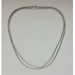 A double strand flat articulated link necklace, stamped 750, length approx. 43cm, weight approx.