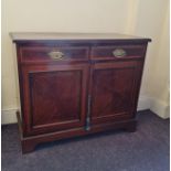 An Edwardian mahogany two door and single drawer cupboard base. IMPORTANT: Online viewing and