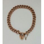 A curb link bracelet with heart padlock clasp, stamped 9c, length approx. 18cm, weight approx. 12.