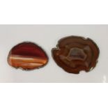 Two white metal edged agate slices, stamps indistinct.