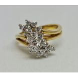 A hallmarked 18ct yellow gold diamond cluster ring, set with 21 variously sized round brilliant