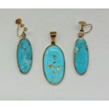 A part-suite of turquoise jewellery, comprising a pendant and earrings set with oval turquoise