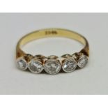 A five stone diamond ring, set with five graduating round brilliant cut diamonds, total diamond