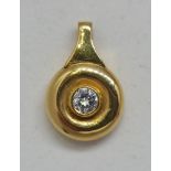 A hallmarked 18ct yellow gold diamond pendant, set with a single central round brilliant cut