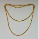 A curb link chain, stamped C18, length approx. 70cm, weight approx. 28.7g. IMPORTANT: Online viewing