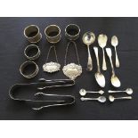 A collection of hallmarked silverware, to include a pair of napkin rings, three single napkin rings