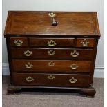 A Georgian mahogany bureau with fitted interior including three long and two short drawers.