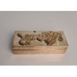 A Chinese white metal box with dragon design to lid, approx. L9.5cms x W 4cms x H 2cms, approx.