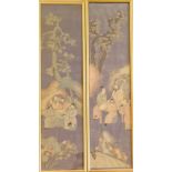 Two framed Chinese silk panels, landscapes with figures around table and trees on blue background,