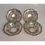 Four silver Elkington & Co. pierced dishes, each hallmarked 1945, makers mark E&Co., each one