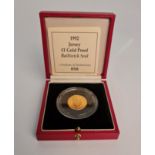 A 1992 Jersey £1 Gold Proof Bailiwick Seal coin in box, N0. 080. IMPORTANT: Online viewing and