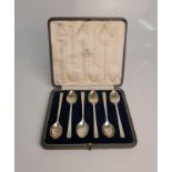 A boxed set of six Art Deco silver spoons, engraved with initial 'G', hallmarked London 1931 (one