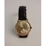 A gents Tudor wrist watch, the champagne tone dial having hourly arrow markers and quarterly