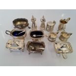 A selection of hallmarked silver to include, mustard pots, cruet set, jug, salt pots, approx. weight