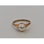 A pearl ring, markings rubbed, ring size P½, approx. weight 2.7gms. IMPORTANT: Online viewing and