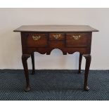 An early 19th century oak three drawer lowboy on four cabriole legs, 72cm x 90.5cm. IMPORTANT: