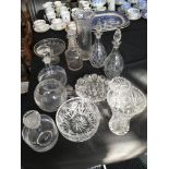 A collection of glassware to include decanters with stoppers, one with Georgian base, cake dish,