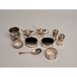 A collection of hallmarked silver to include, a cruet set comprising a pair of pepperettes, two