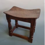A Robert Mouseman Thompson of Kilburn stool, with burr oak saddle seat and oak four leg