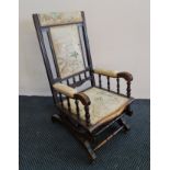 A walnut Edwardian American style rocking chair. IMPORTANT: Online viewing and bidding only.