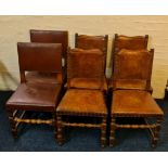 A set of four oak dining chairs with brown leather studded backs and seats, together with another