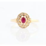 A hallmarked 9ct yellow gold ruby and diamond cluster ring, ring size Q, approx. weight 2g.
