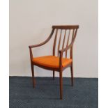 *A teak mid century design carver armchair with orange upholstered seat. IMPORTANT: Online viewing
